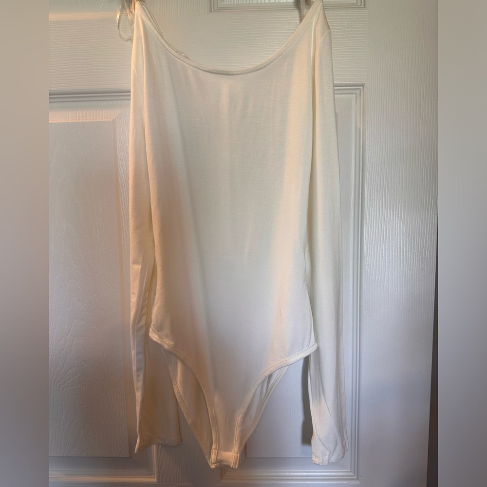Naked wardrobe backless bodysuit medium